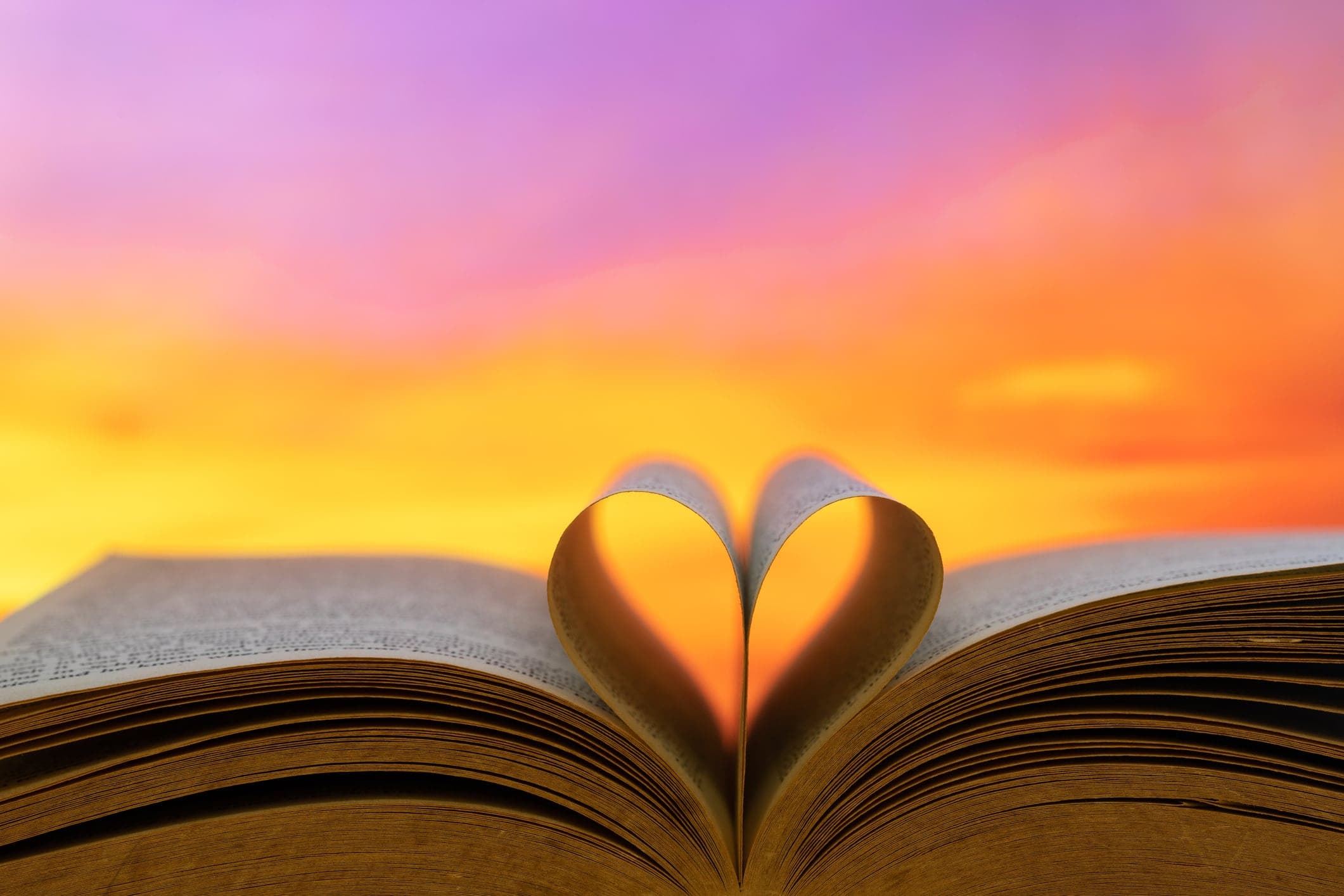 book heart pages sunset