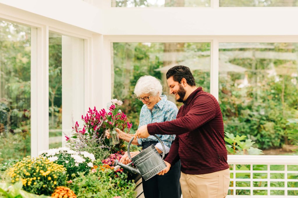 caretaker and resident gardening in community