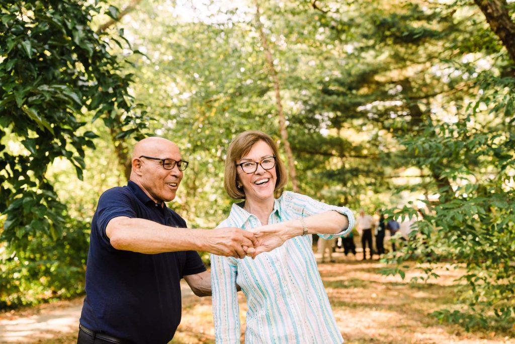 elderly woman and caregiver dancing