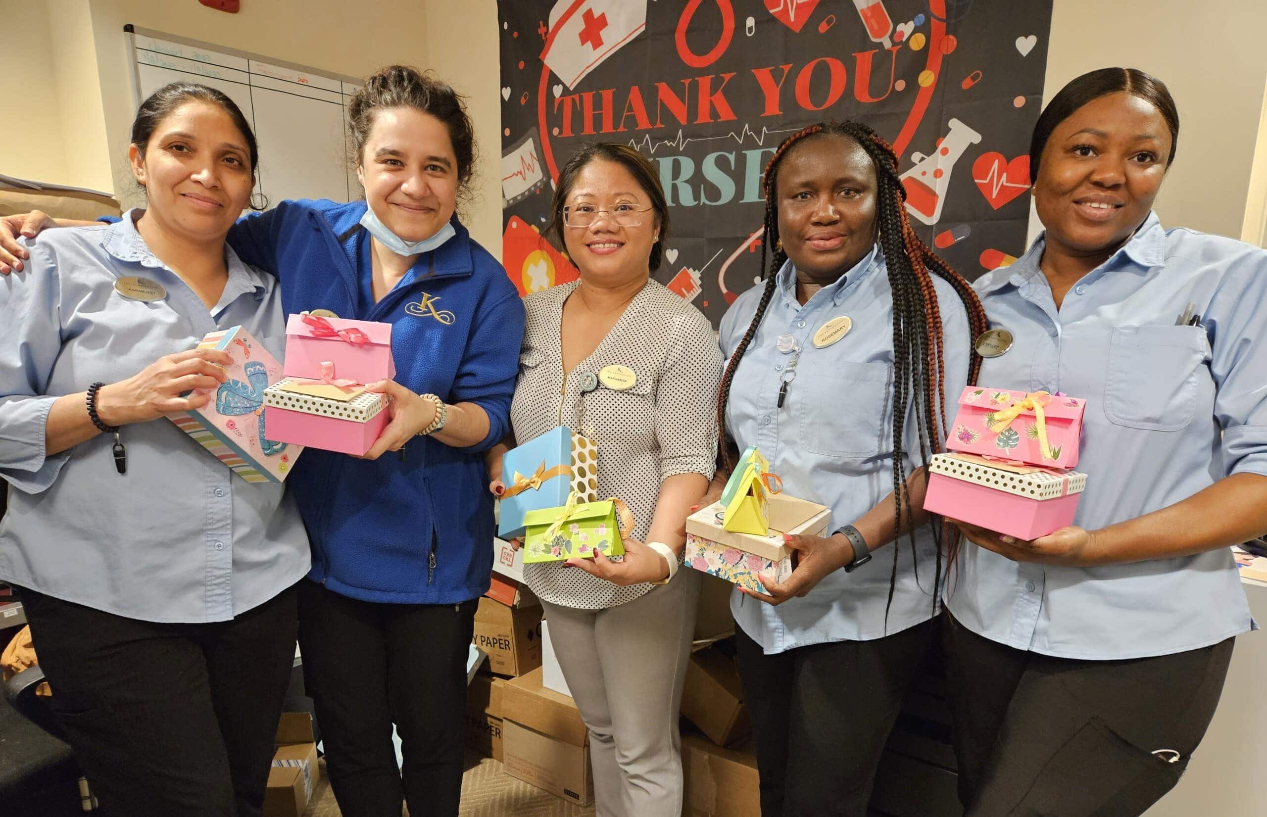 care team members with gifts