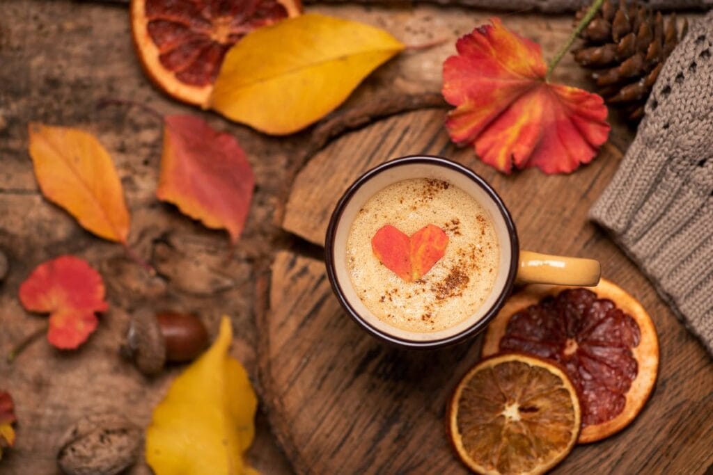 coffee, fall leaves, and orange slices