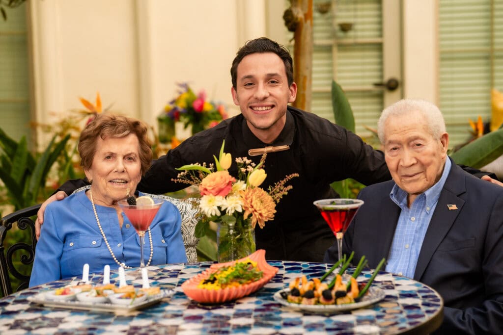 dining team member and an elderly couple