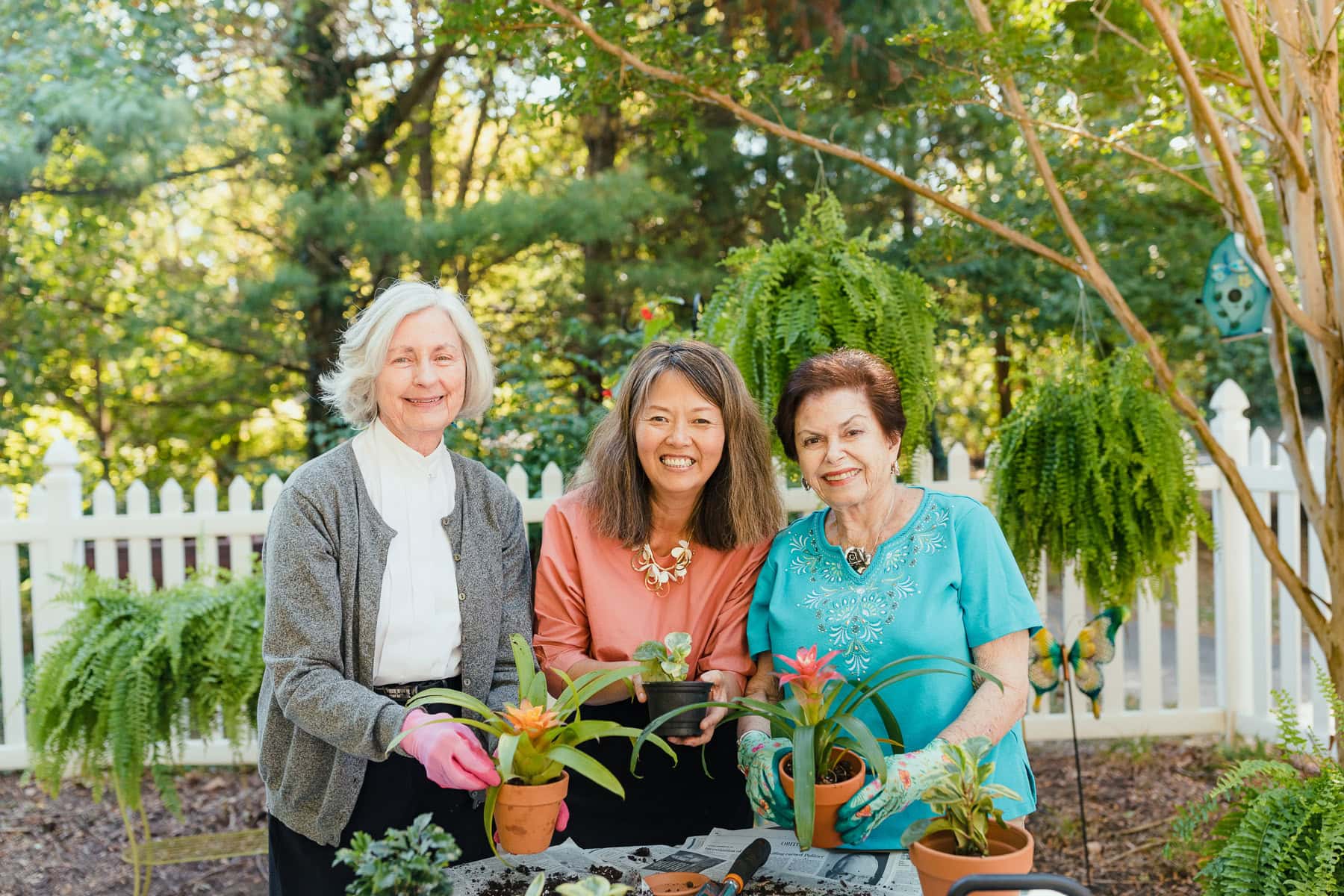 team member and residents gardening