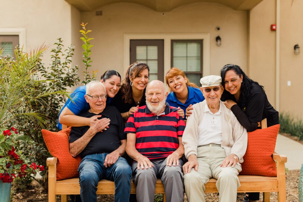 group photo of team members and residents