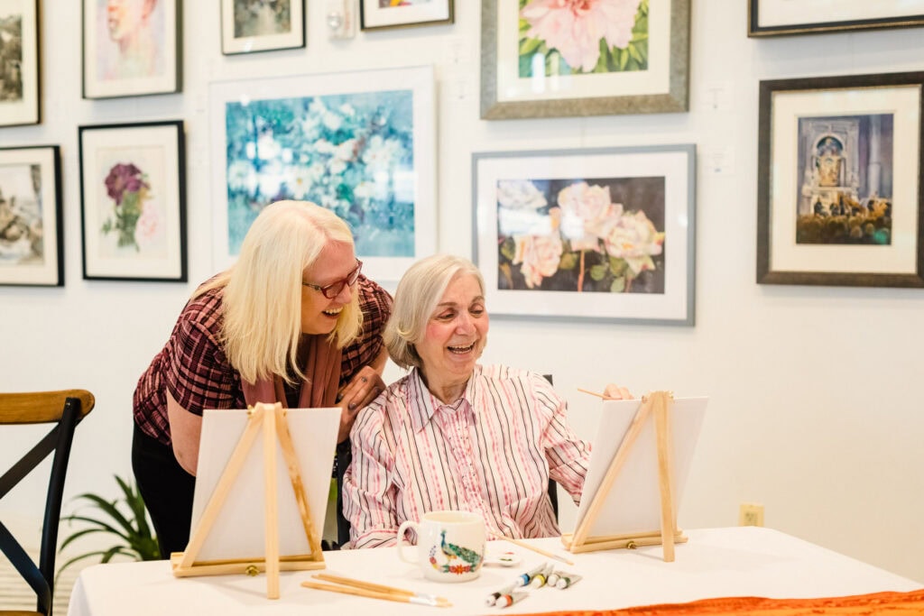 two women painting together